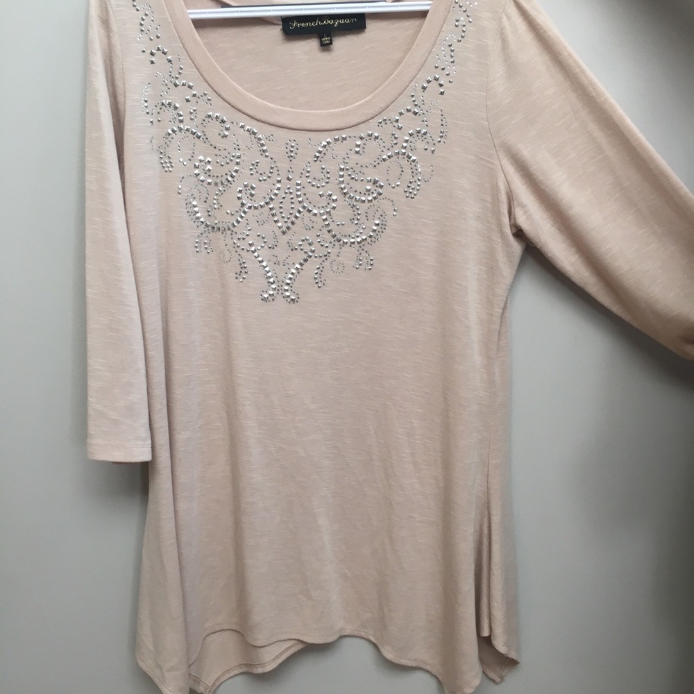 Cream color top with silver embellishment